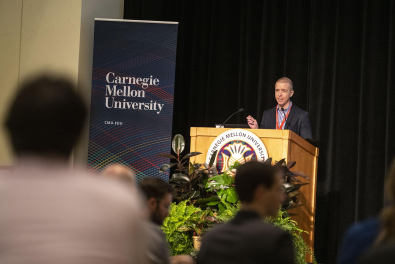 Daniel Tkacik speaks at a podium